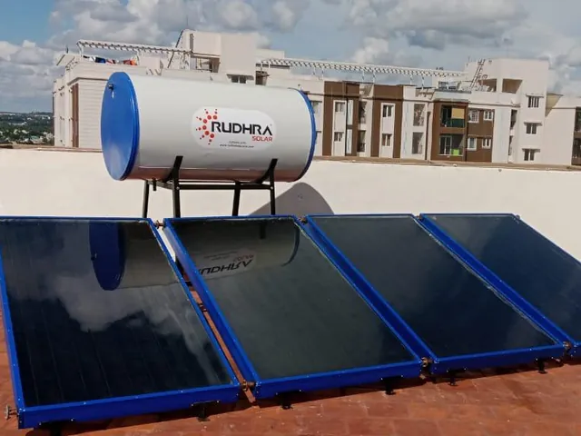 Rudhra Solar water heater with four flat plate collectors on a residential rooftop